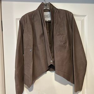 Faux leather jacket with cowl neck opening.